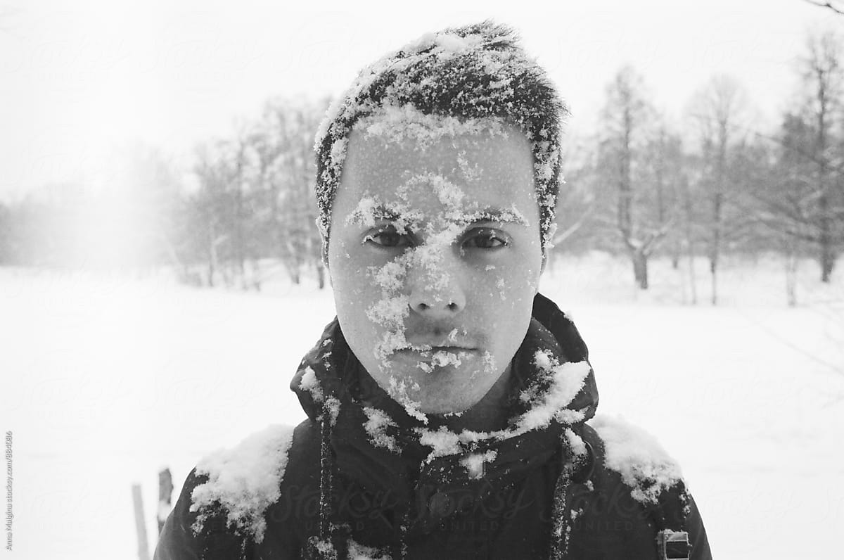 A handsome man with snow on his face