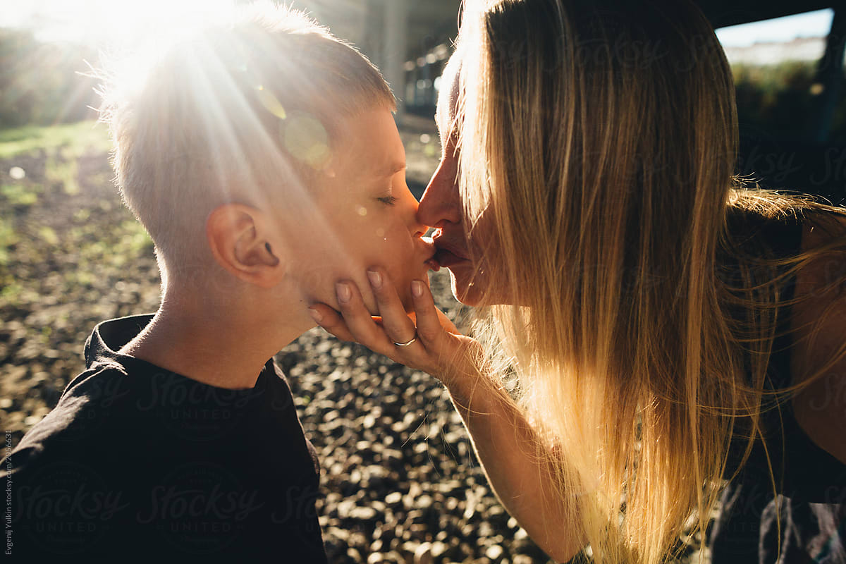 Mother Kissing Son by Evgenij Yulkin.
