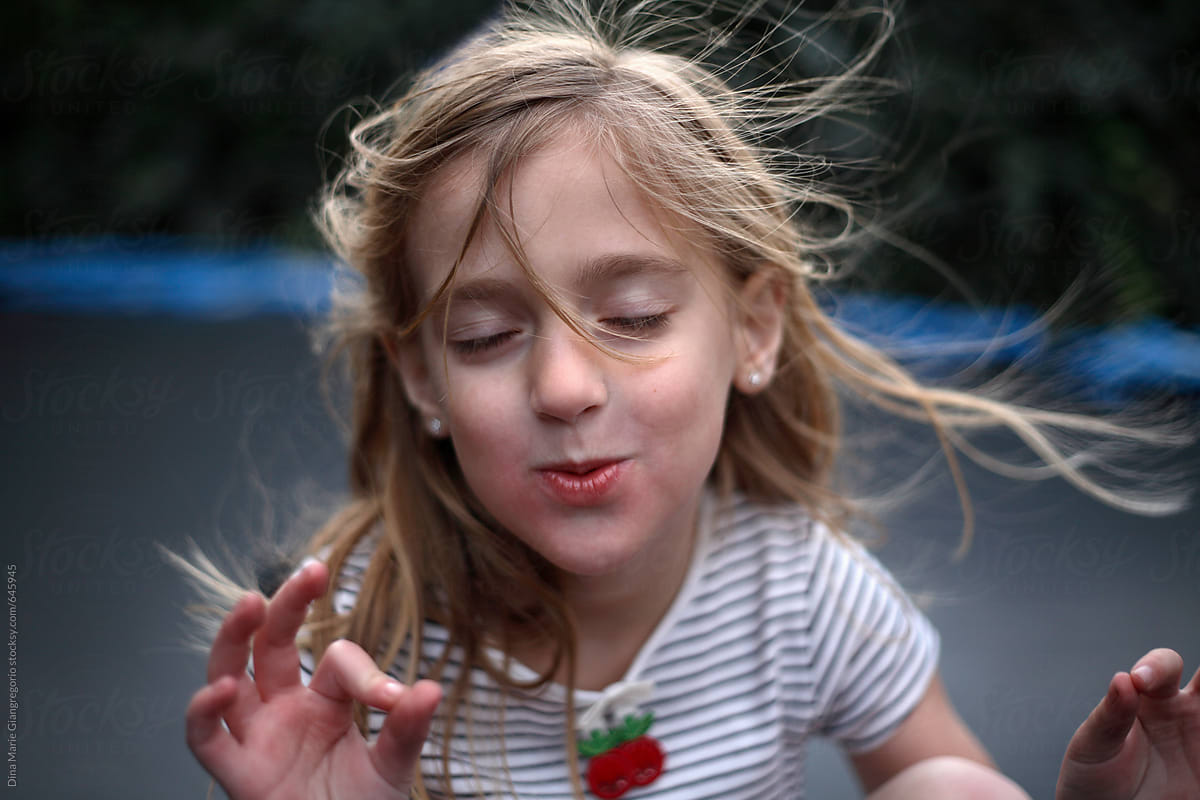 Young Girl Meditating With Her Eyes Closed By Stocksy Contributor Dina Marie Giangregorio