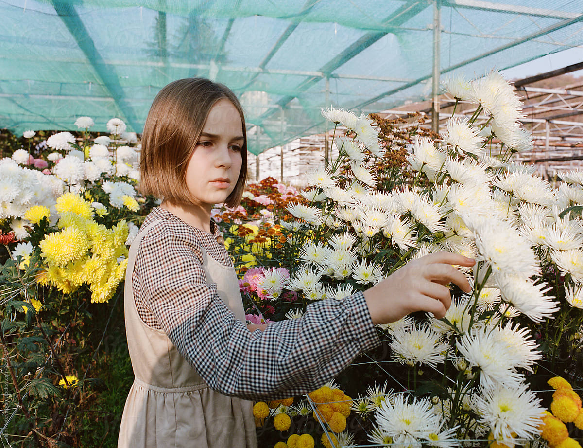 Beautiful Sad Girl In A Greenhouse
