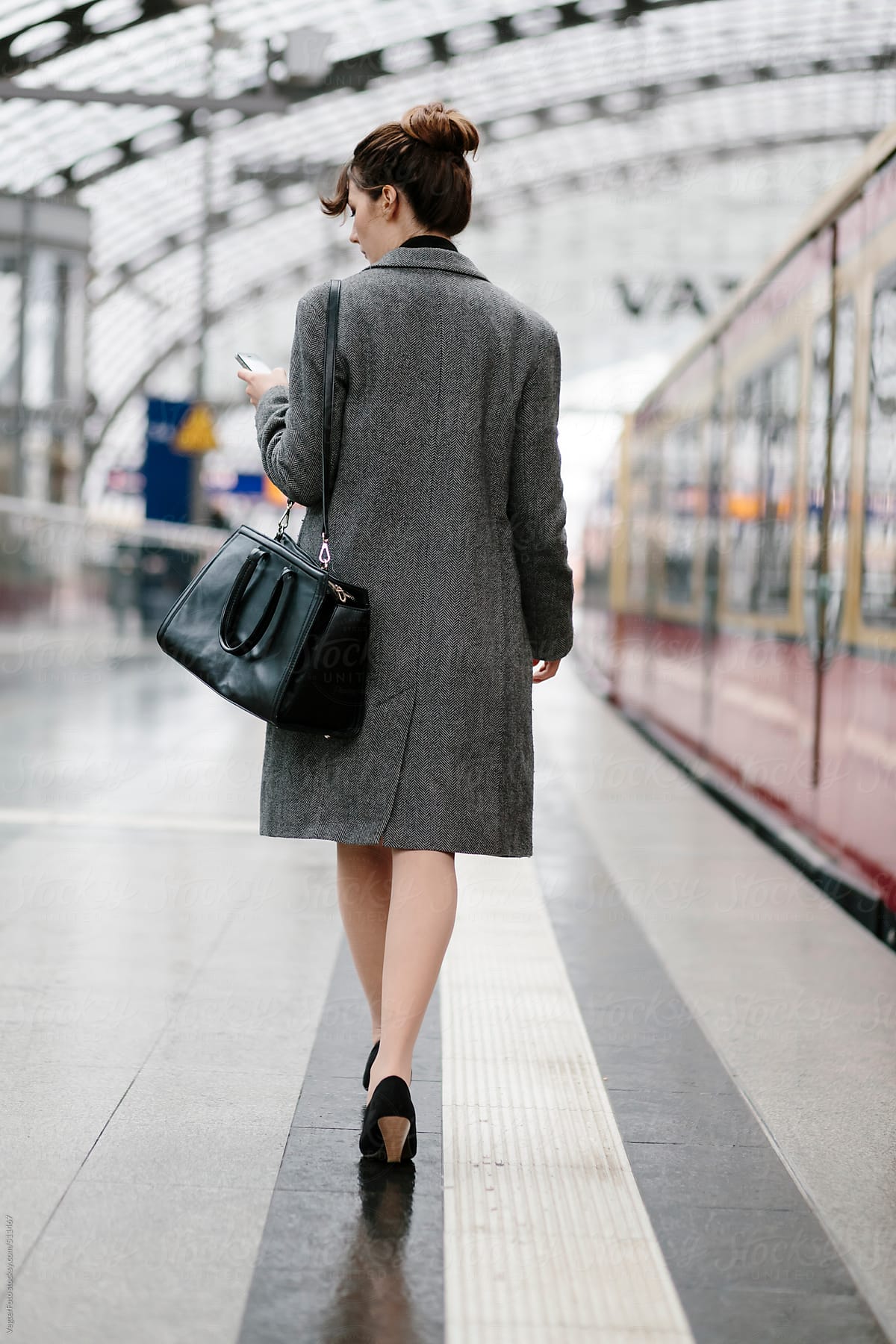 Businesswoman walking On Train Station Platform