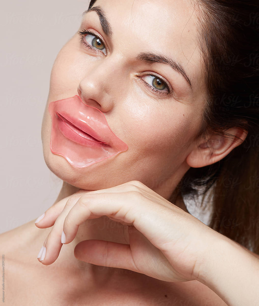 Woman using gel lips patch mask
