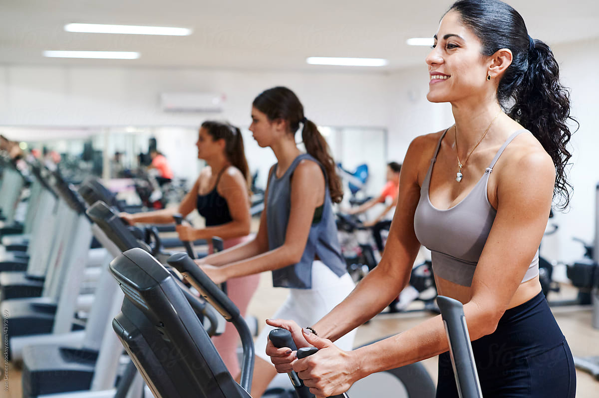 Smiling woman exercising on a treadmill