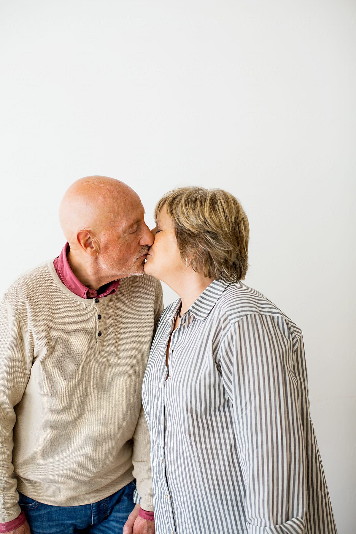 elderly couple kissing