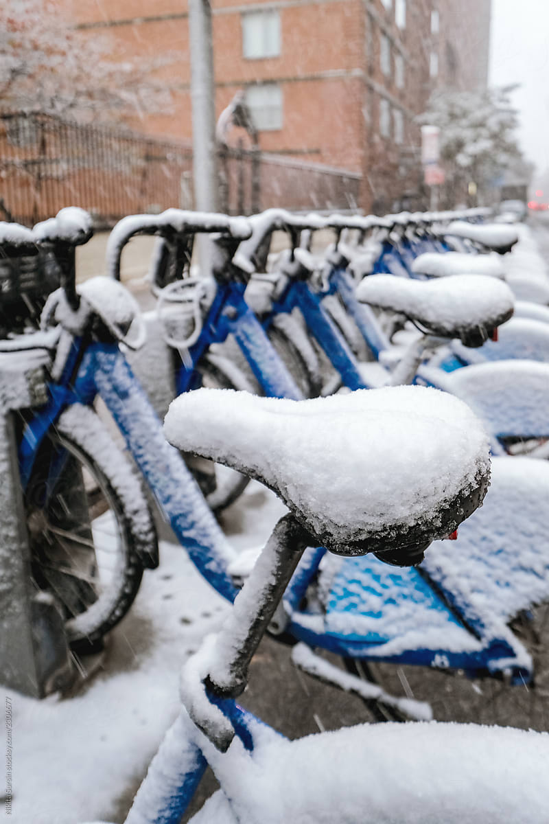 Bicycle completely covered with snow parked  in winter, New York City