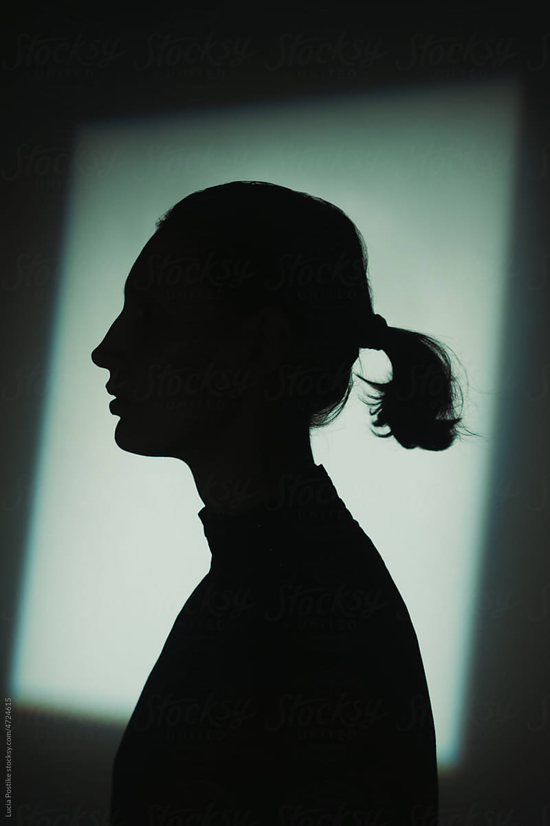 Silhouette portrait of young woman