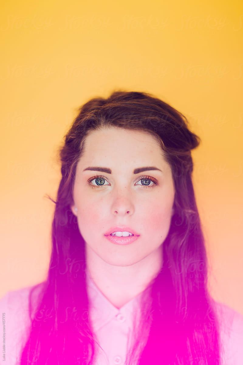Young girl on yellow background with pink highlight