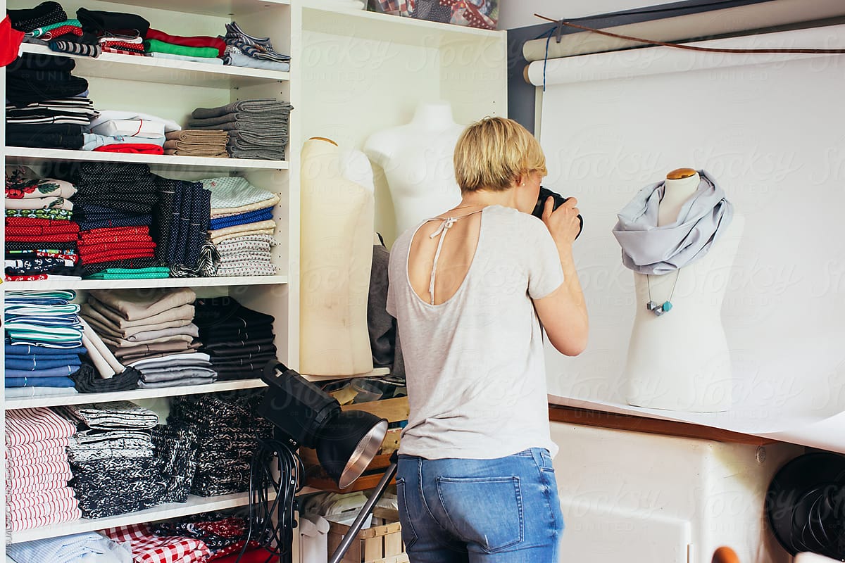 Self-Employment - Female Fashion Designer Photographing Scarf on Display Dummy
