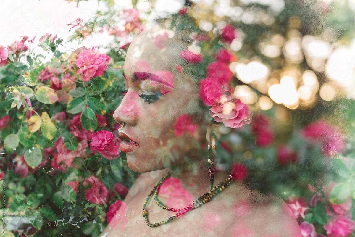 Double exposure of a woman in a rose garden
