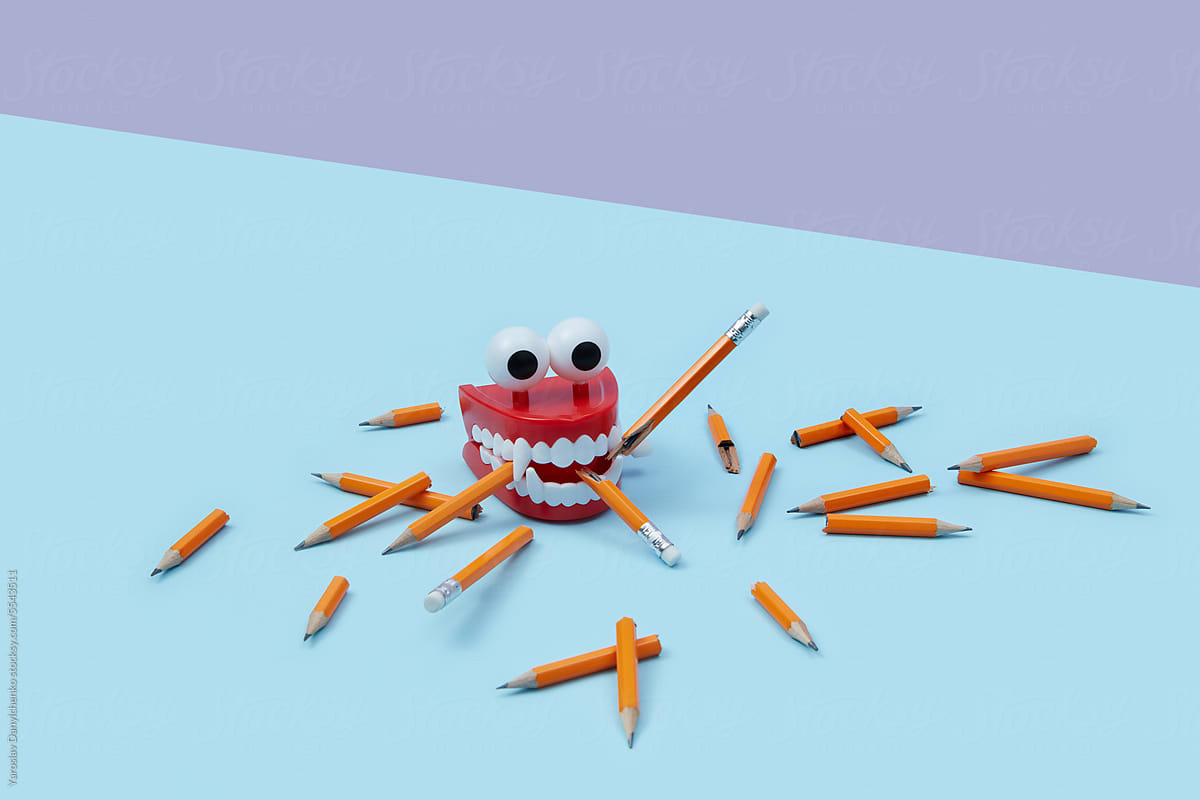 Plastic toy jaws chewing broken pencils.
