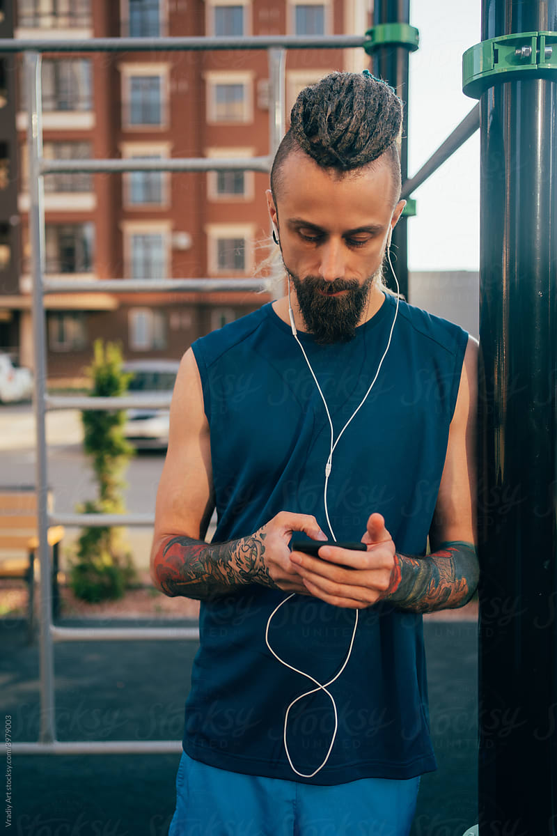 Young man listening to music on workout