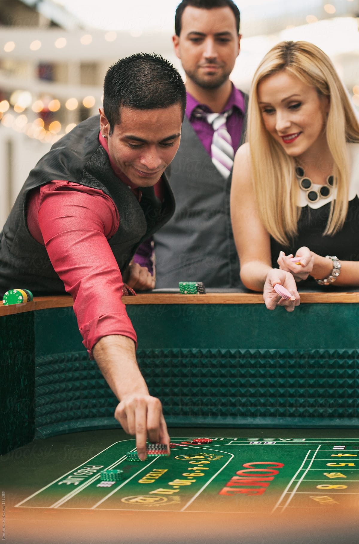Casino: People Placing Bets On Craps Table