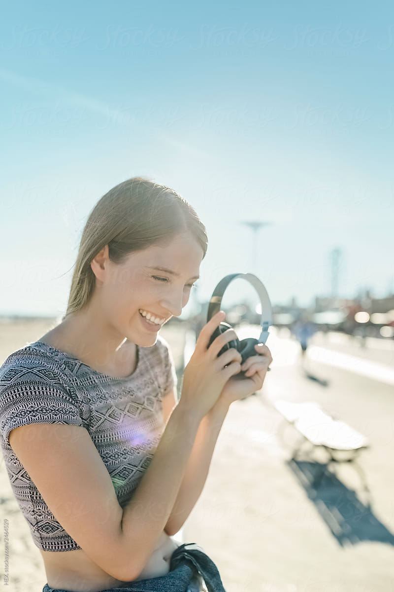 Young Beautiful Smiling White Woman Portrait With Black Headphones Listening Music. Lifestyle Stock Picture