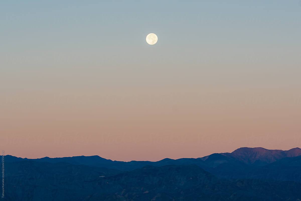 Bright Moon upon the Silhouette of Mountains