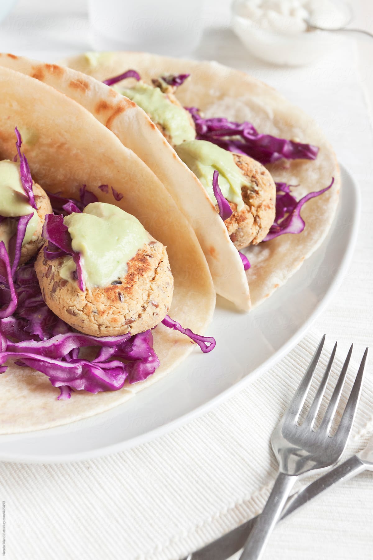 Homemade tacos with cabbage slaw, chickpea patties and sauce