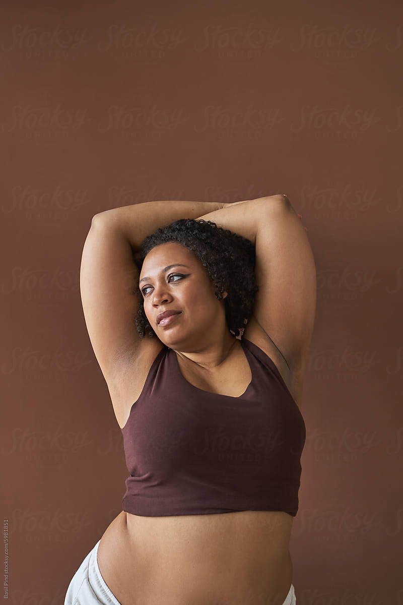 Woman in Casual Attire Enjoying a Stretch