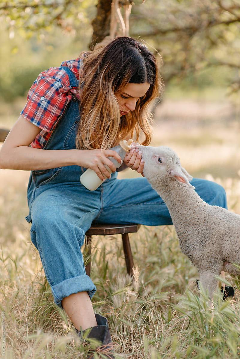 Farm Girl Feeding Animals