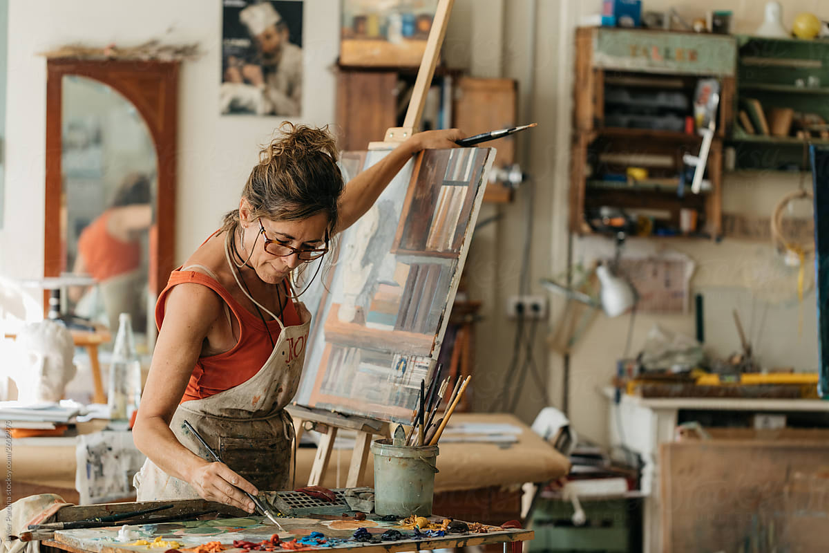 Woman Painting A Canvas By Stocksy Contributor Javier Pardina Stocksy