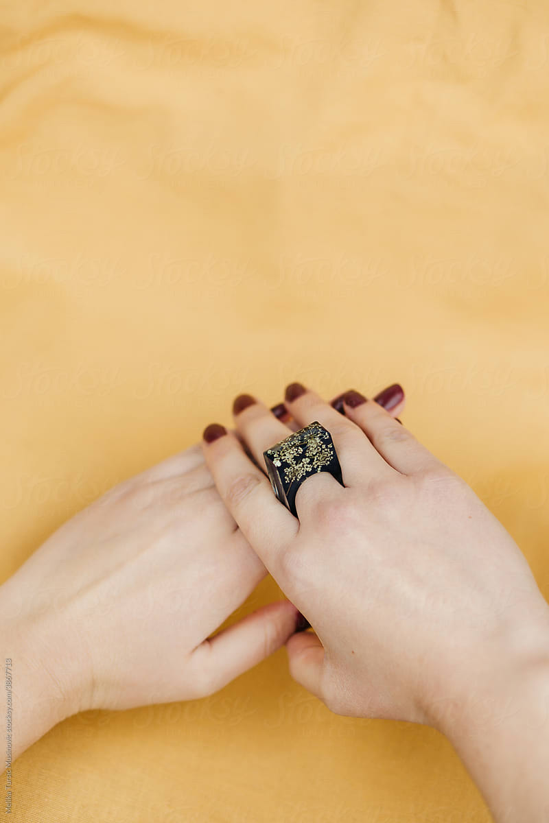 Studio shoot of female hands wearing handmade rings