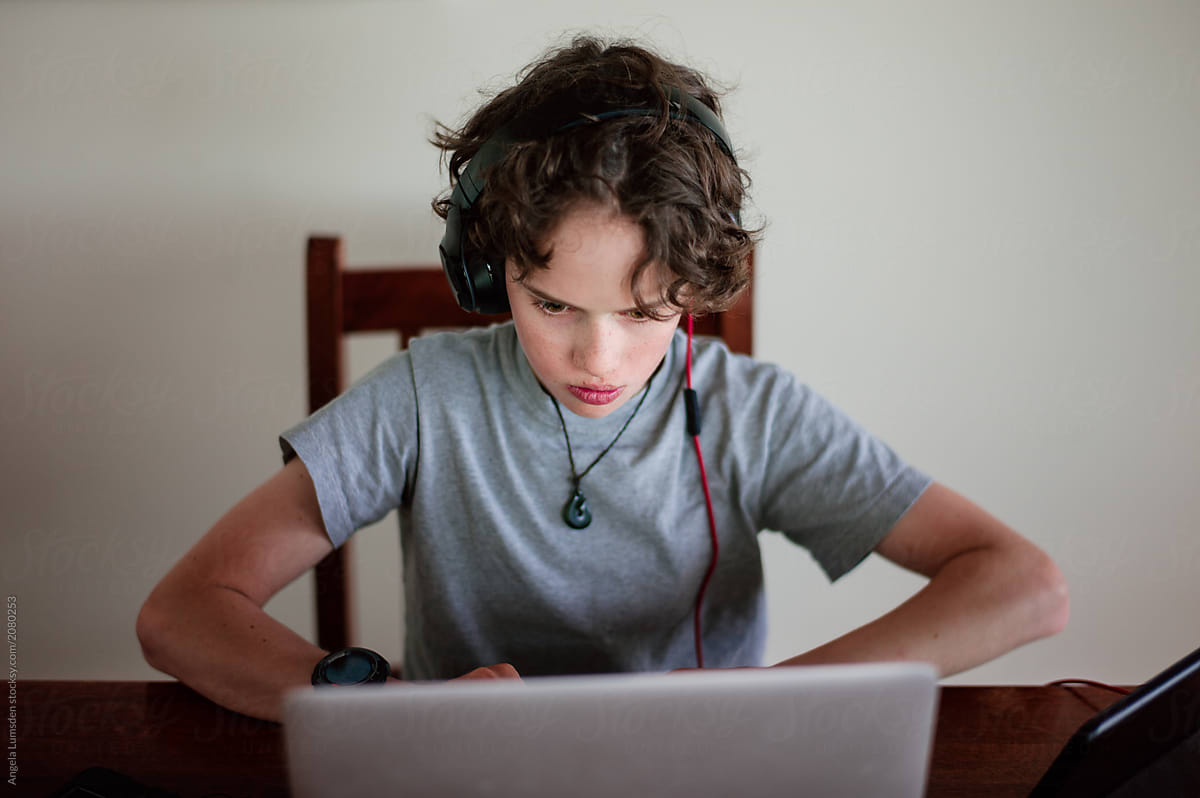 Boy doing school work on a computer