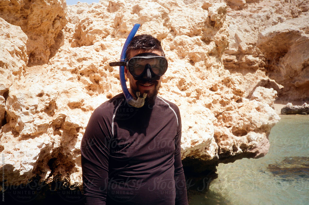 Man at the beach ready for snorkeling