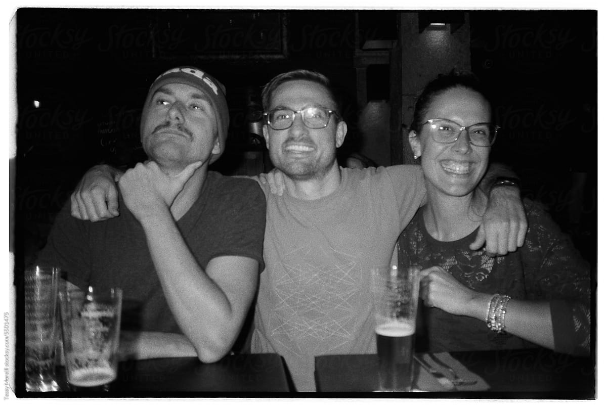 Three happy friends at the pub