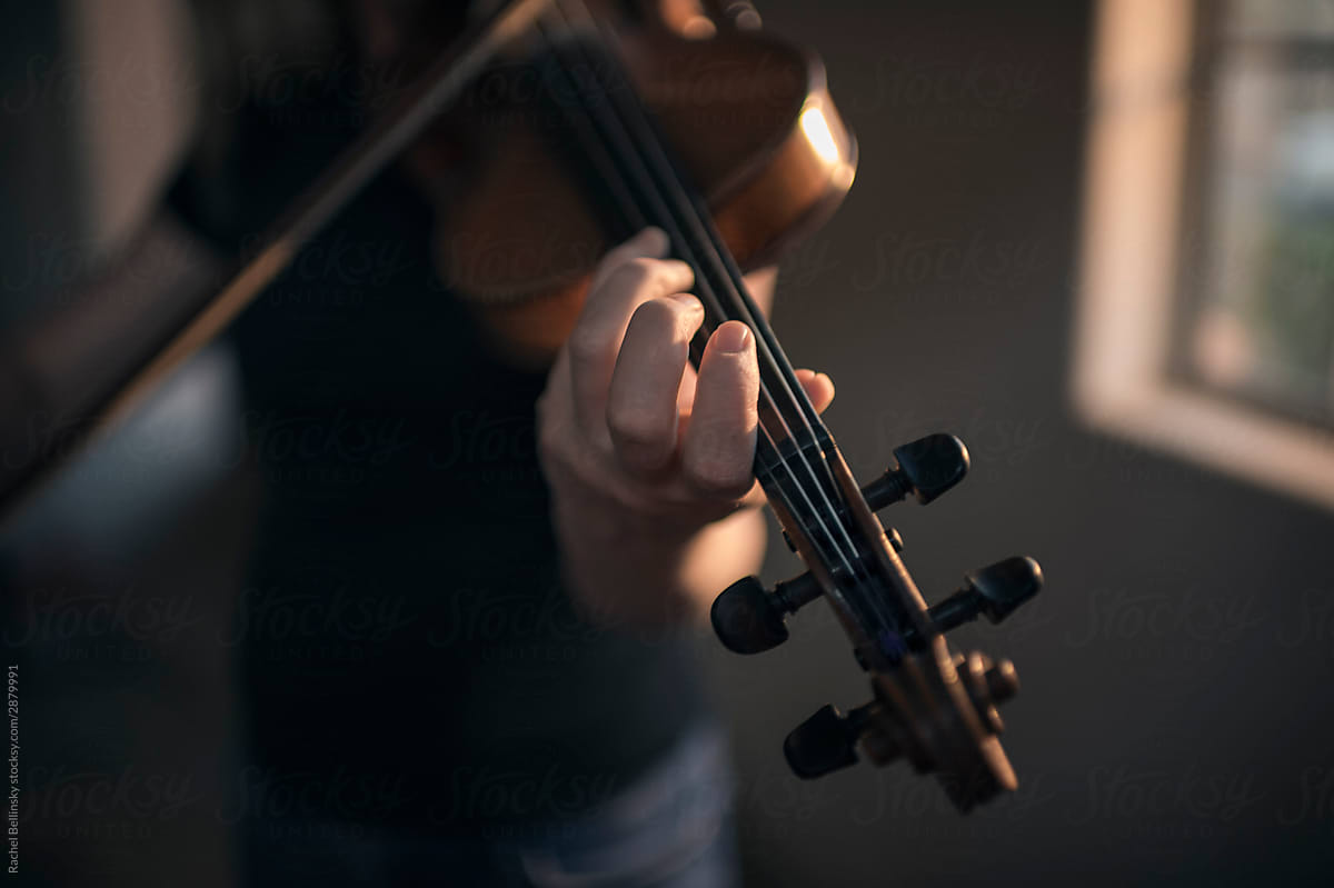 A beautiful woman plays the violin