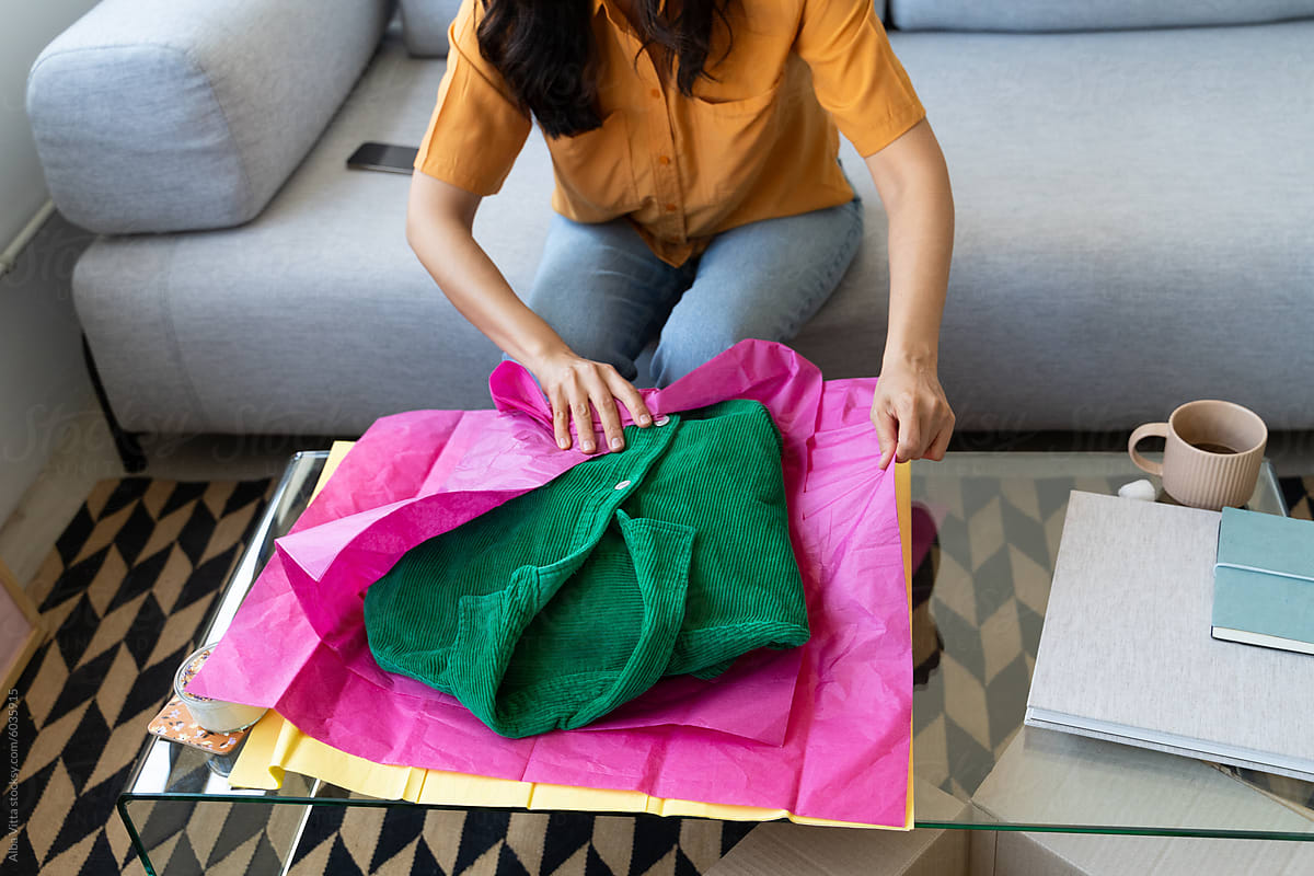 Woman Packaging Clothes To Send