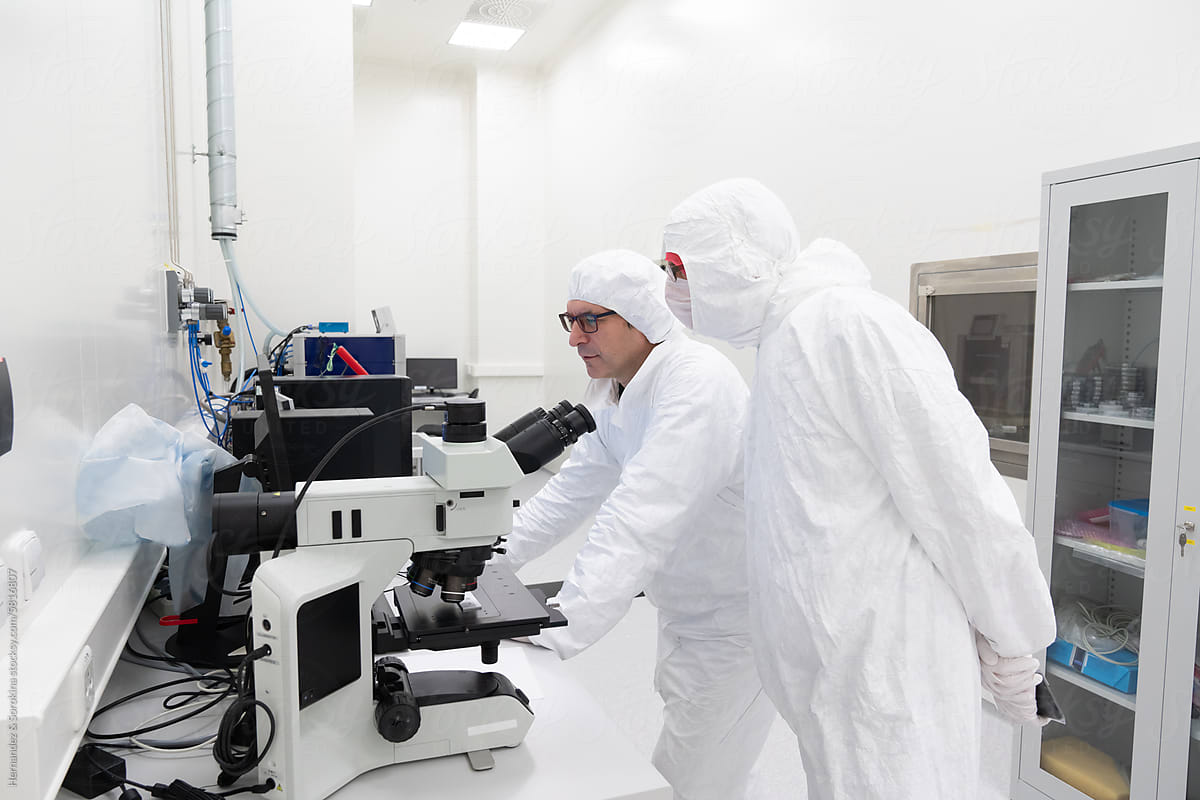 Researchers Working At Clean Room