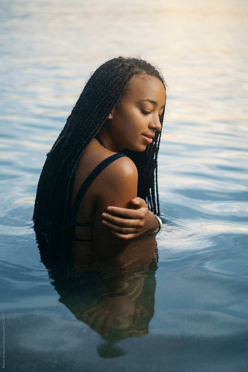 Portrait Of Beautiful Black Woman With Long Hair In The Water Del