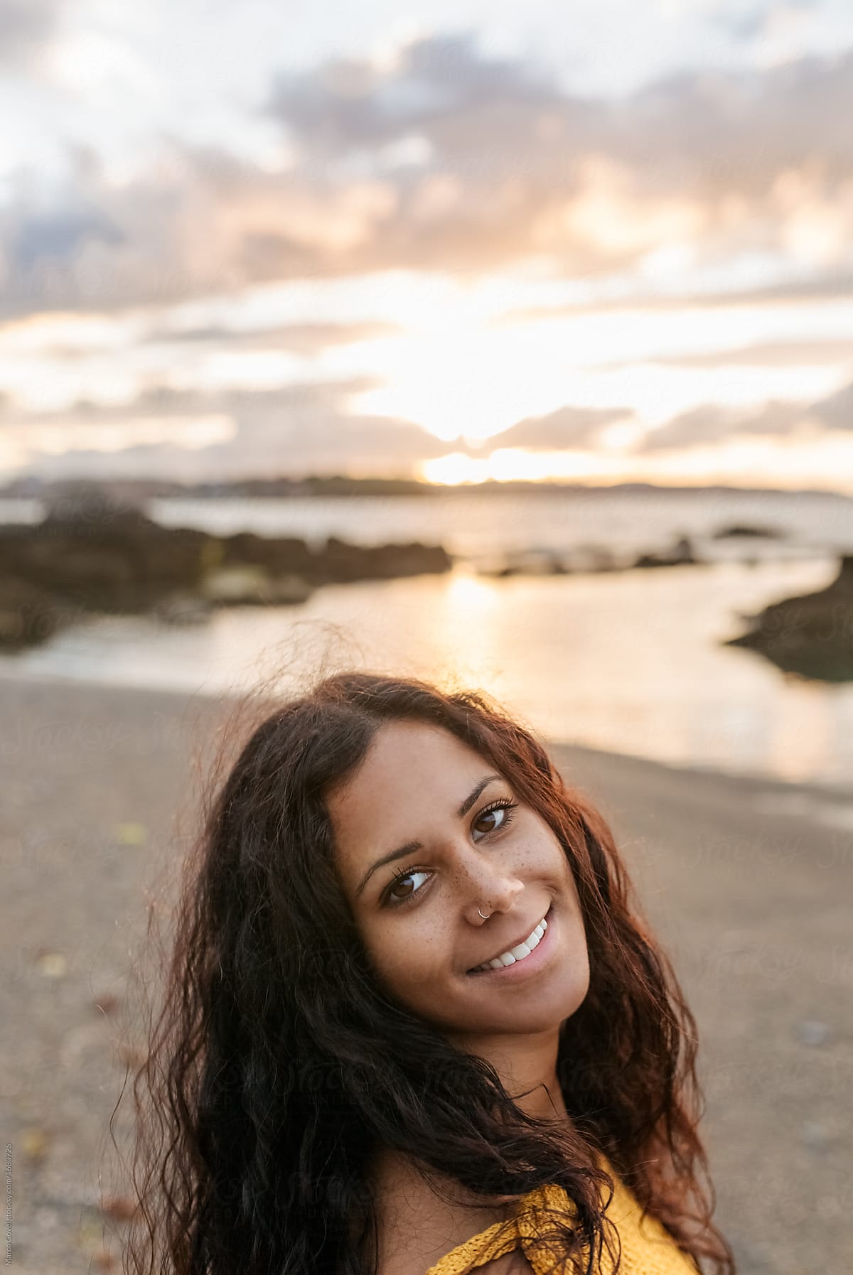 Portrait Of A Beautiful Mixed Race Woman On The Beach Del Colaborador De Stocksy Marco Govel