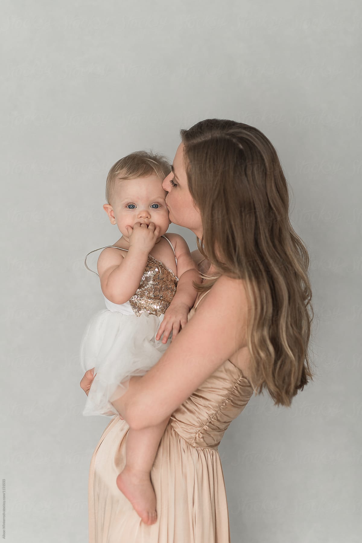 Mother Kissing Her Daughter By Stocksy Contributor Alison Winterroth