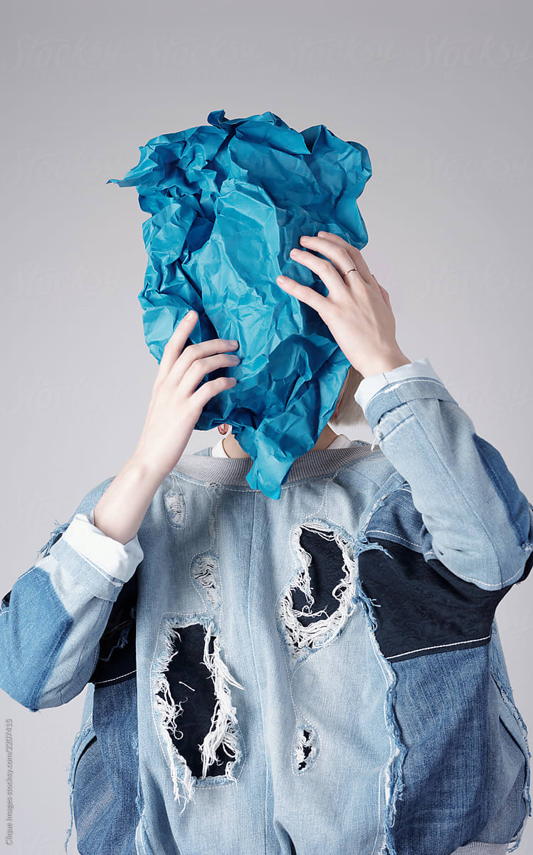 Woman Hiding With Rumpled Paper