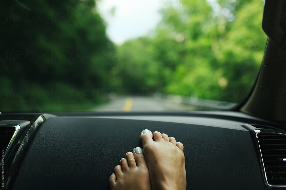 Womans Feet On The Dashboard Of A Car During A Road Trip By Stocksy Contributor Kelly Knox