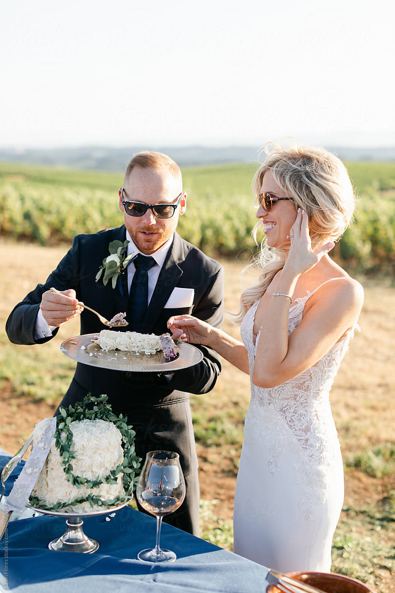 Attractive Couple Eating Wedding Cake