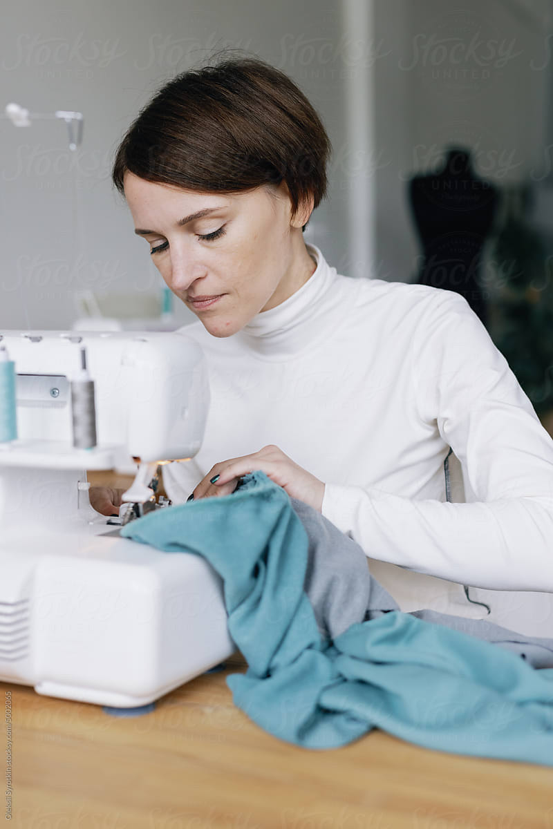 Textile machine. Dressmaker studio. Fashion industry. Sewing