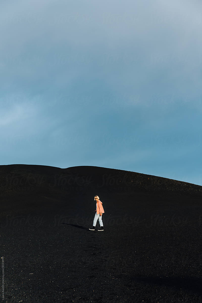 Adventure Woman Walking On A Black Landscape