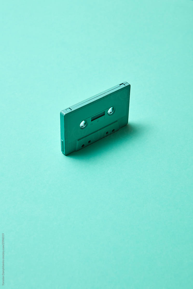Retro cassette tapes on a turquoise color pantone background, copy space. Trend of minimalism.
