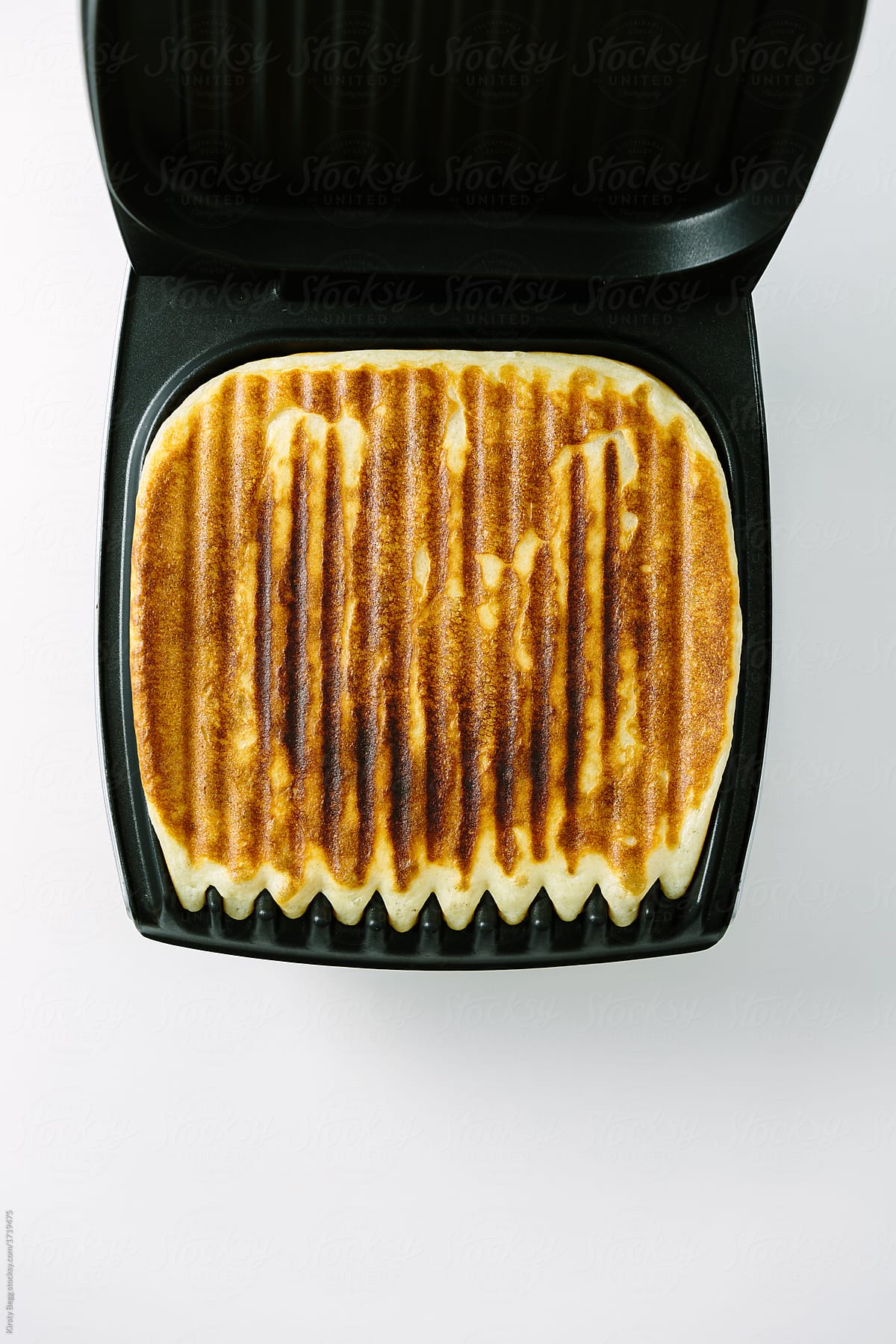 Grill or griddle with waffle batter cooked