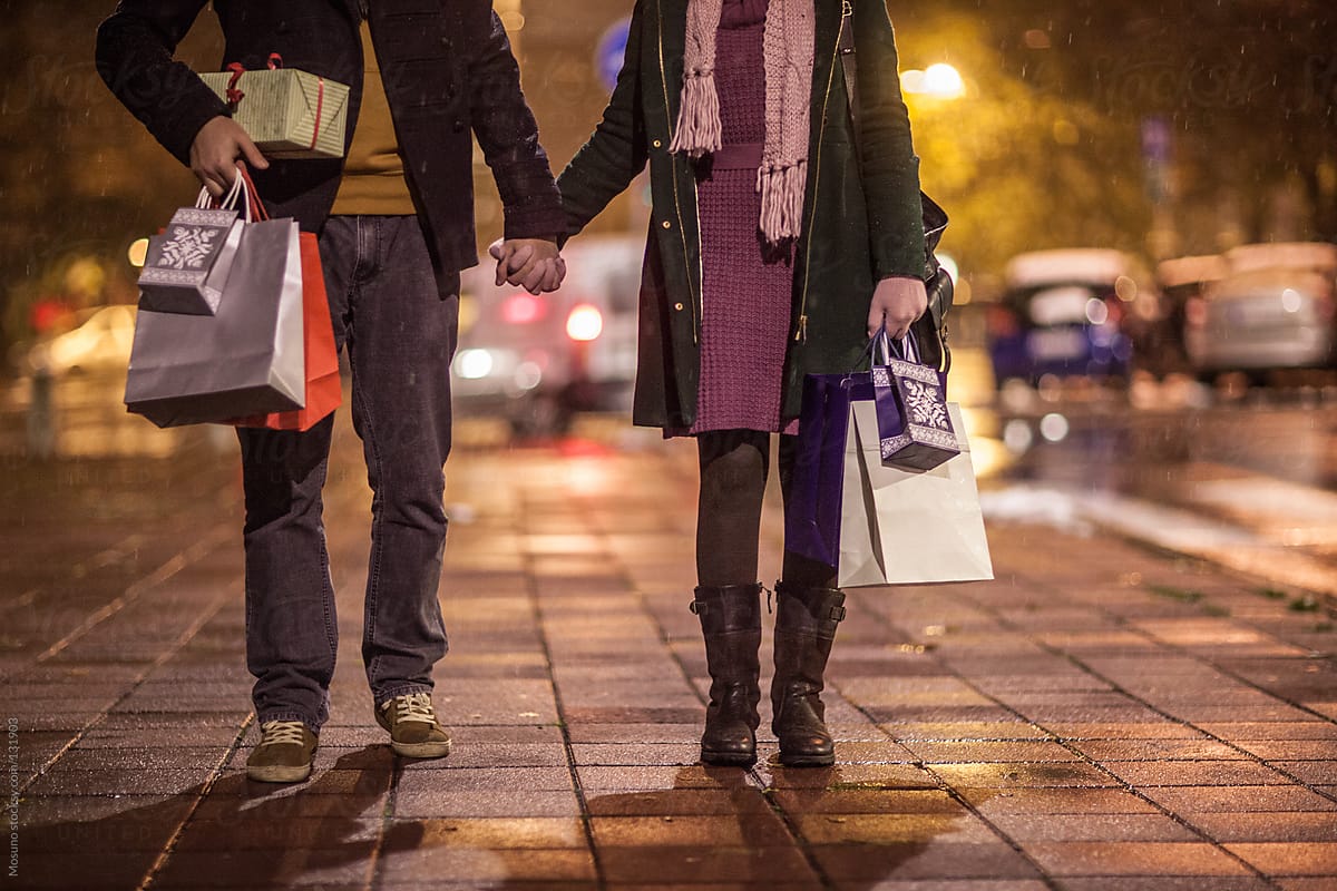Couple Walking With Bags and Christmas Gifts