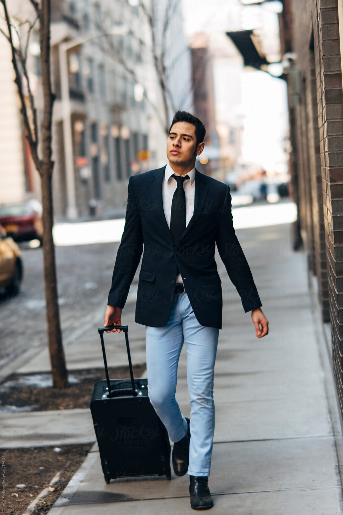 Stylish Mexican Businessman With Suitcase In the City