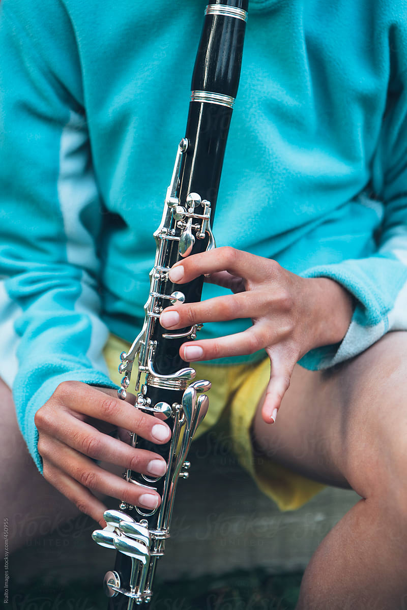 Close up of girl playing clarinet