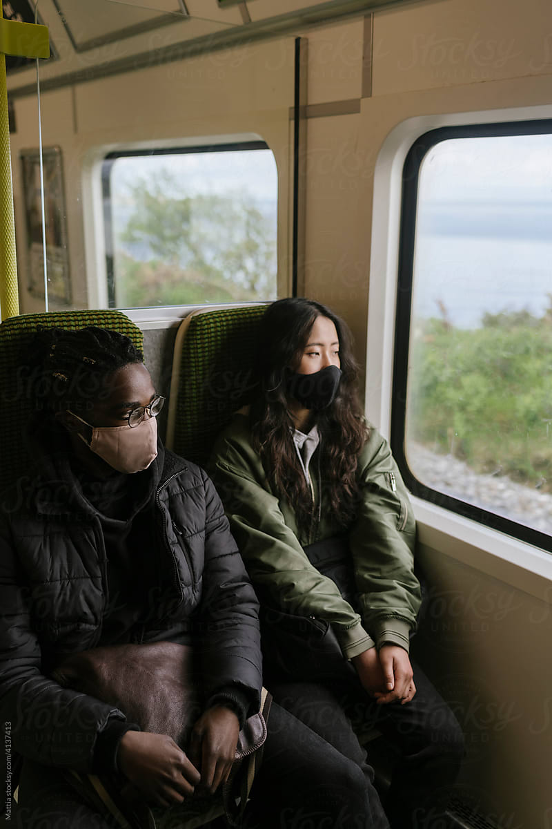 Couple Travel by Train With Face Mask