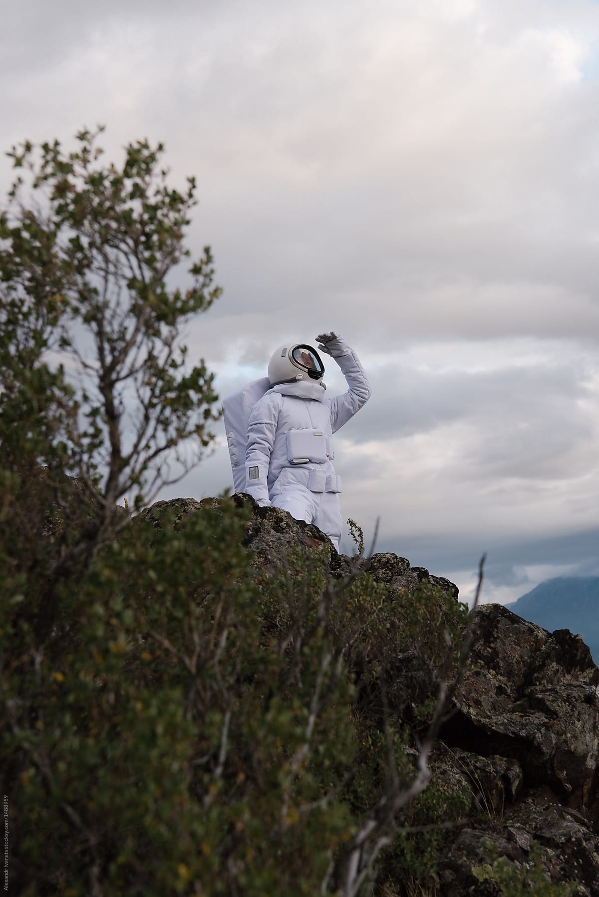 Astronaut looking at sky on nature