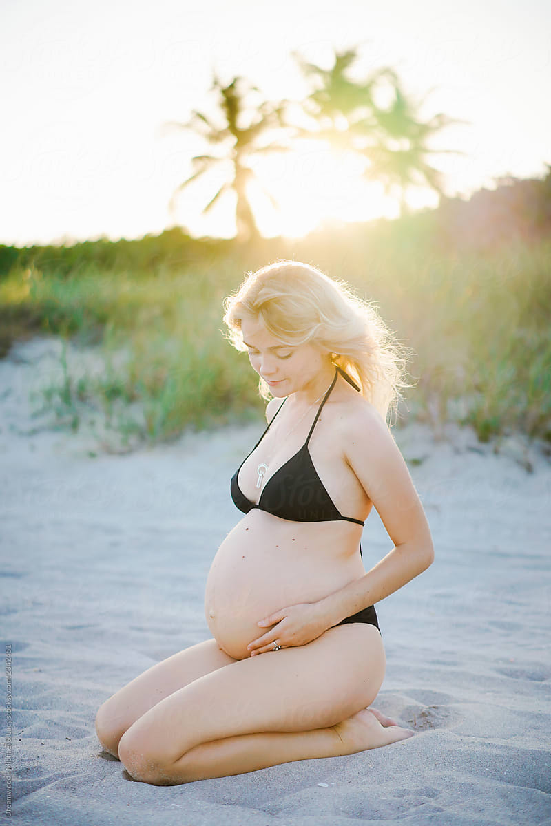 Pregnant Woman In Panties Touching Belly by Stocksy Contributor Dreamwood  Photography  - Stocksy