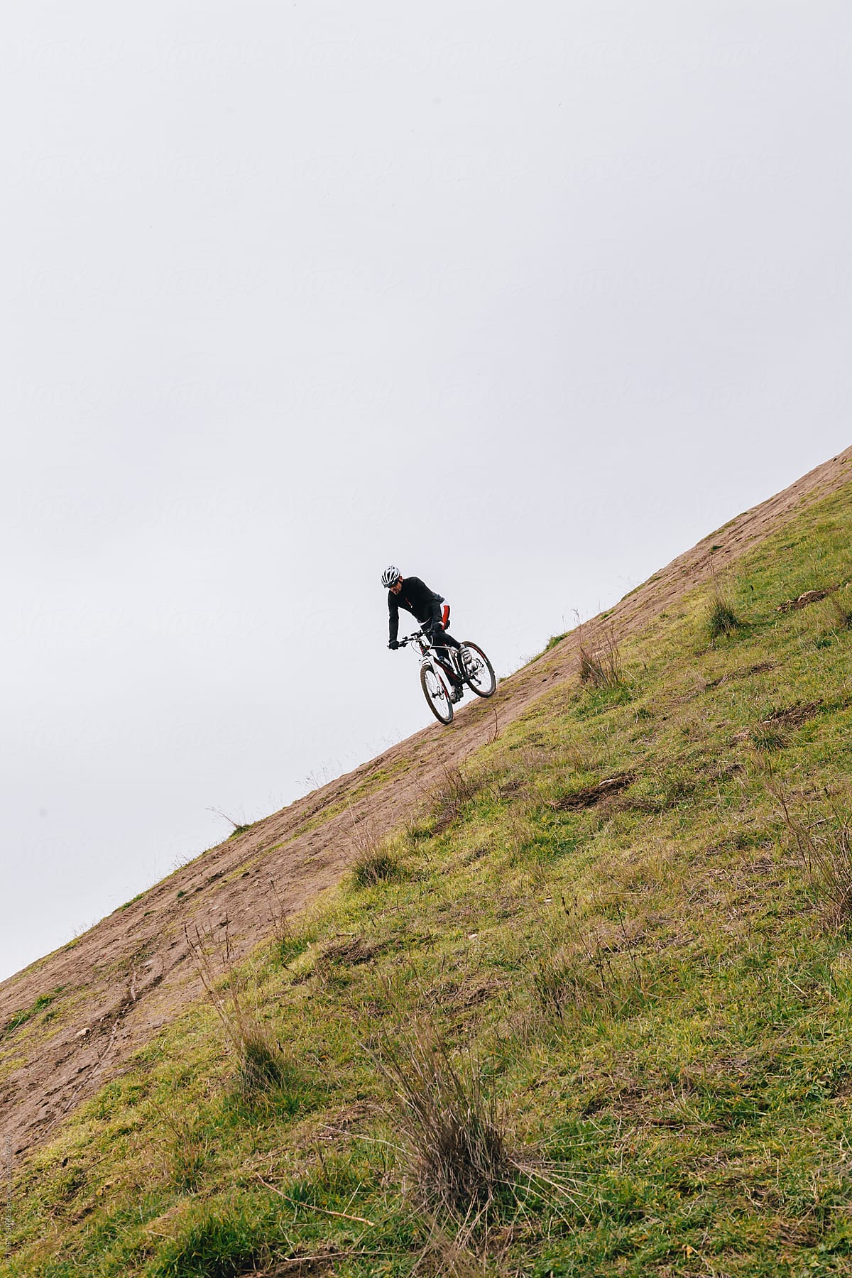 Mountain Bike Rider Downing a Hill