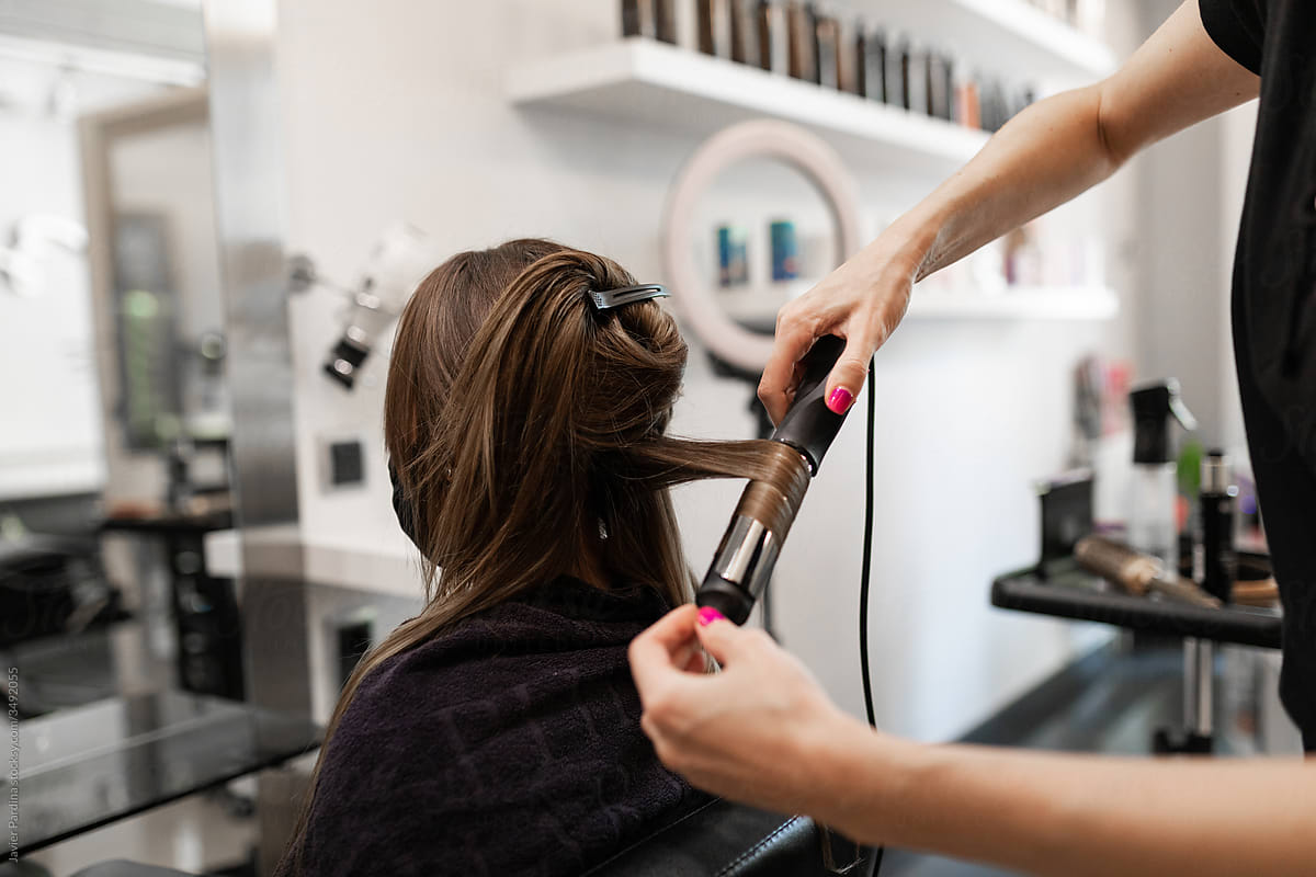 hairdresser preparing hair for cutting