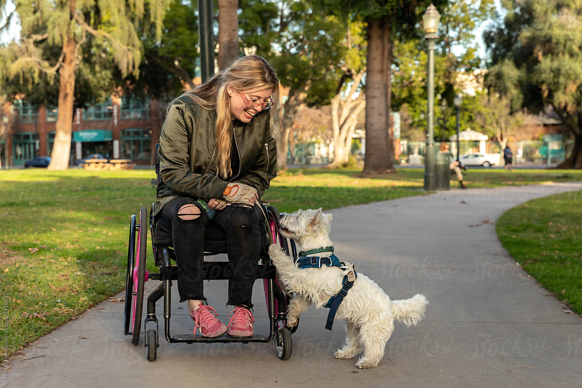 Woman with a Disability and Her Dog in a Public Park