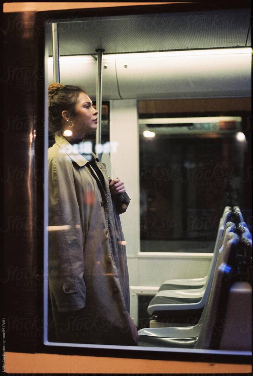 Woman commuting in train late in the night