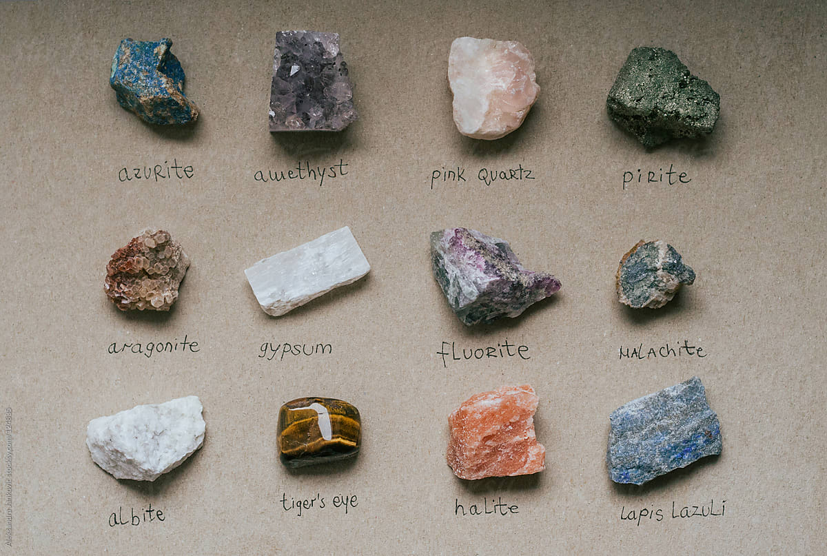 Collection of semi precious stones and crystals with their names written by...